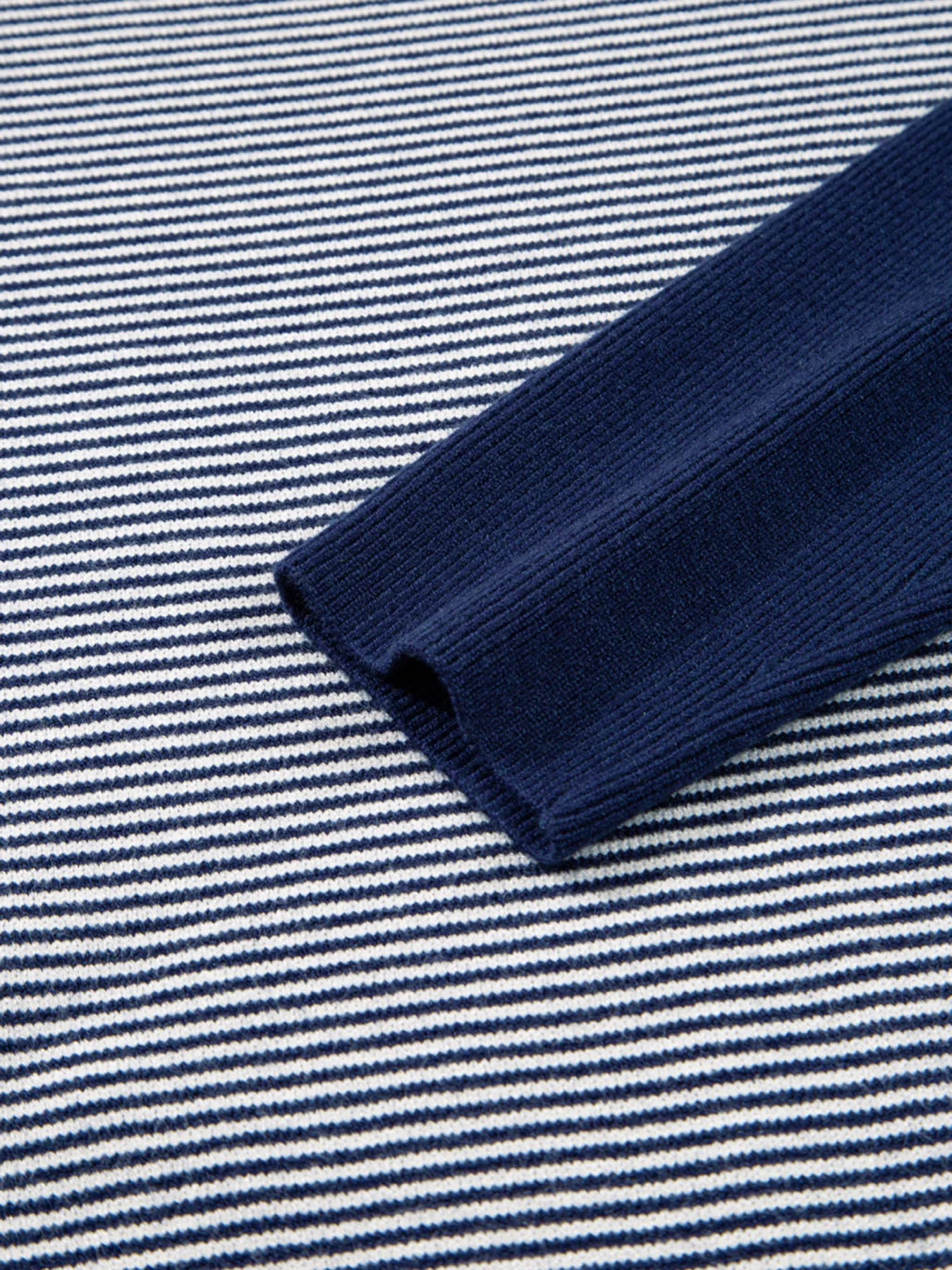Navy and white striped knit tunic sweater with ribbed navy sleeve cuff