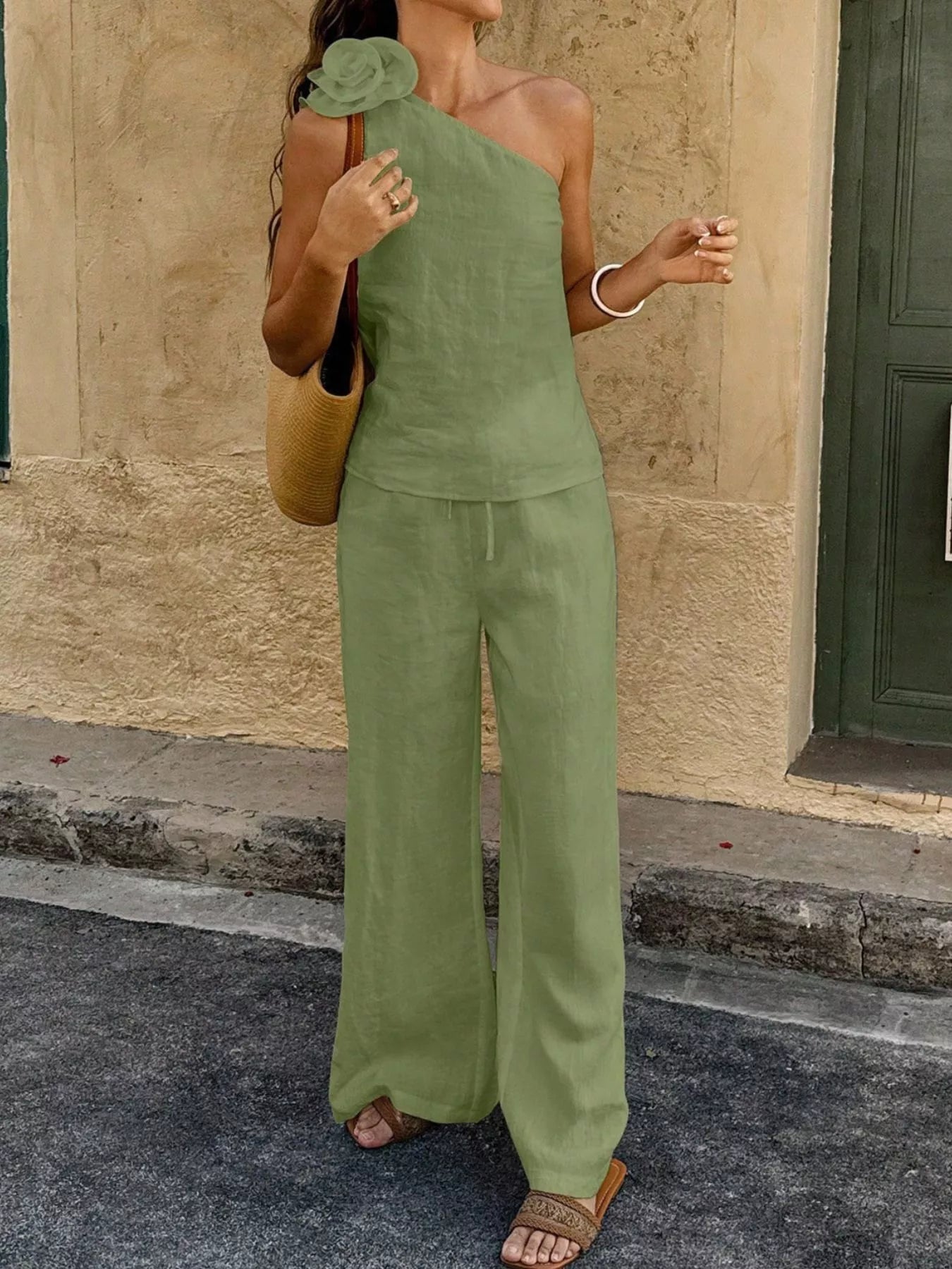 One-shoulder embellished top and pants set in mint green with rosette at one shoulder