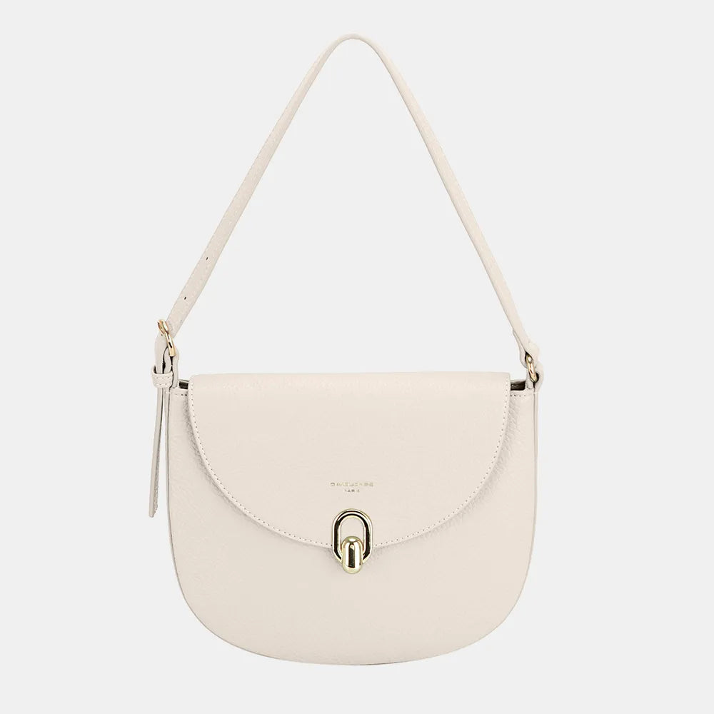Ivory half-moon shoulder bag with metal buckle clasp and long shoulder strap.