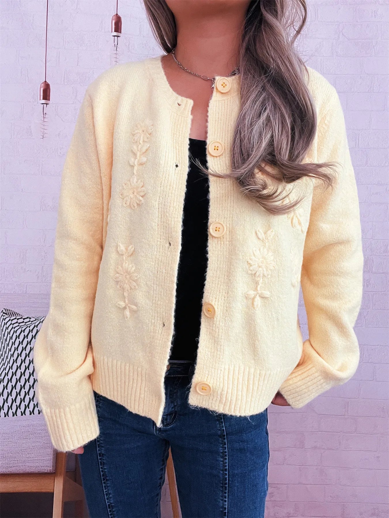 Beige cardigan with flower embroidery, button front, and ribbed cuffs