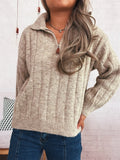 Ribbed hem quarter zip sweater in heather beige, zip neck and long ribbed sleeves.