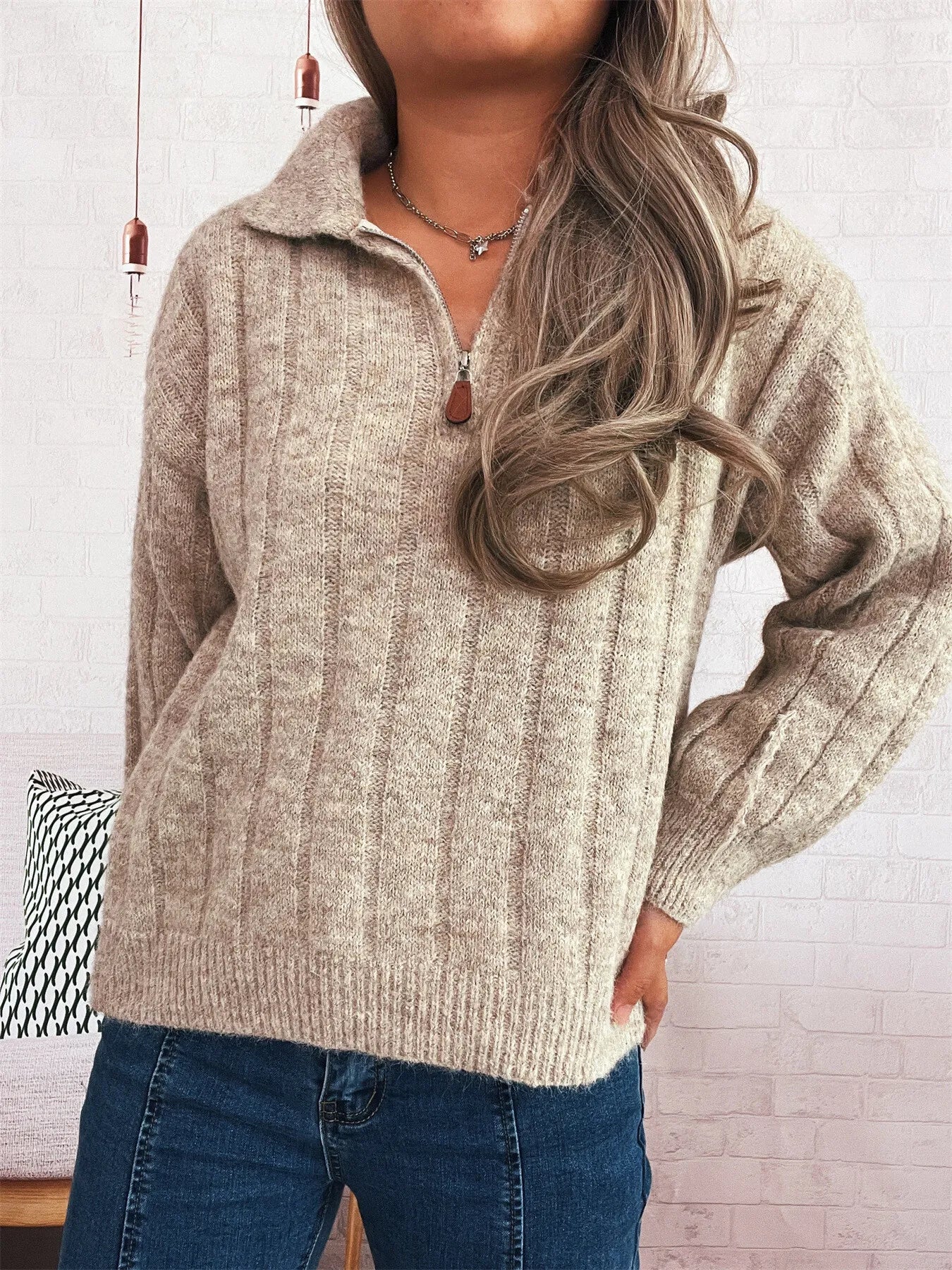 Ribbed hem quarter zip sweater in heather beige, zip neck and long ribbed sleeves.