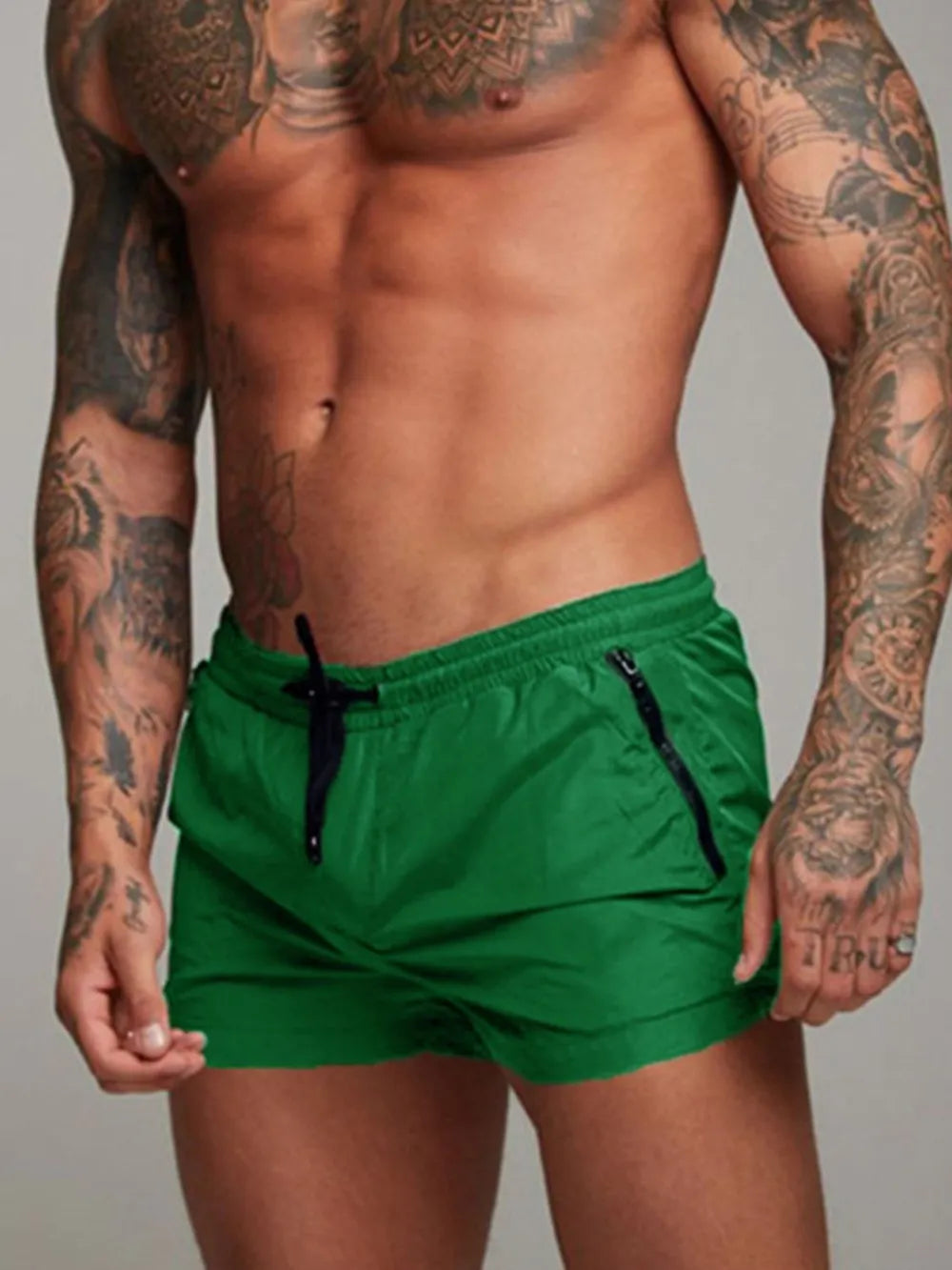 Men's active shorts in green with drawstring ties and side pockets