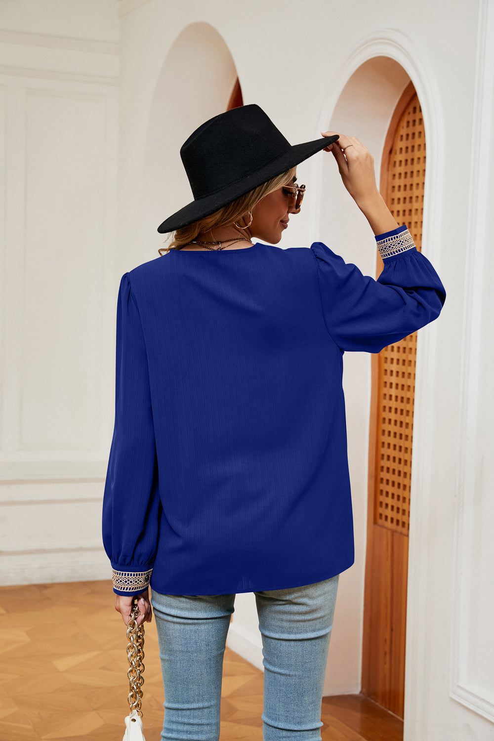 Dark blue contrast V-neck puff sleeve blouse, back view
