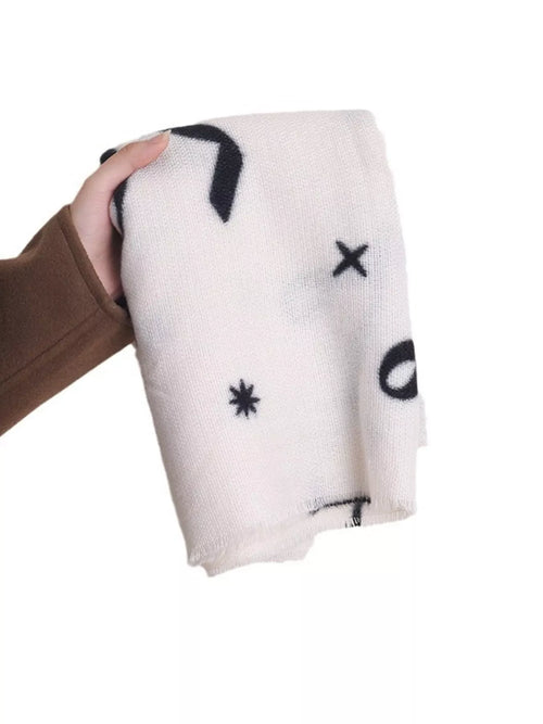 Lightweight scarf, light neutral with black bow and star prints, fringed edges
