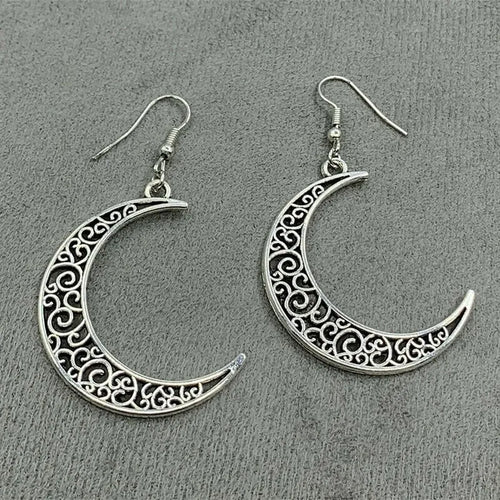 Silver-tone crescent moon earrings with engraved filigree border, drop hooks