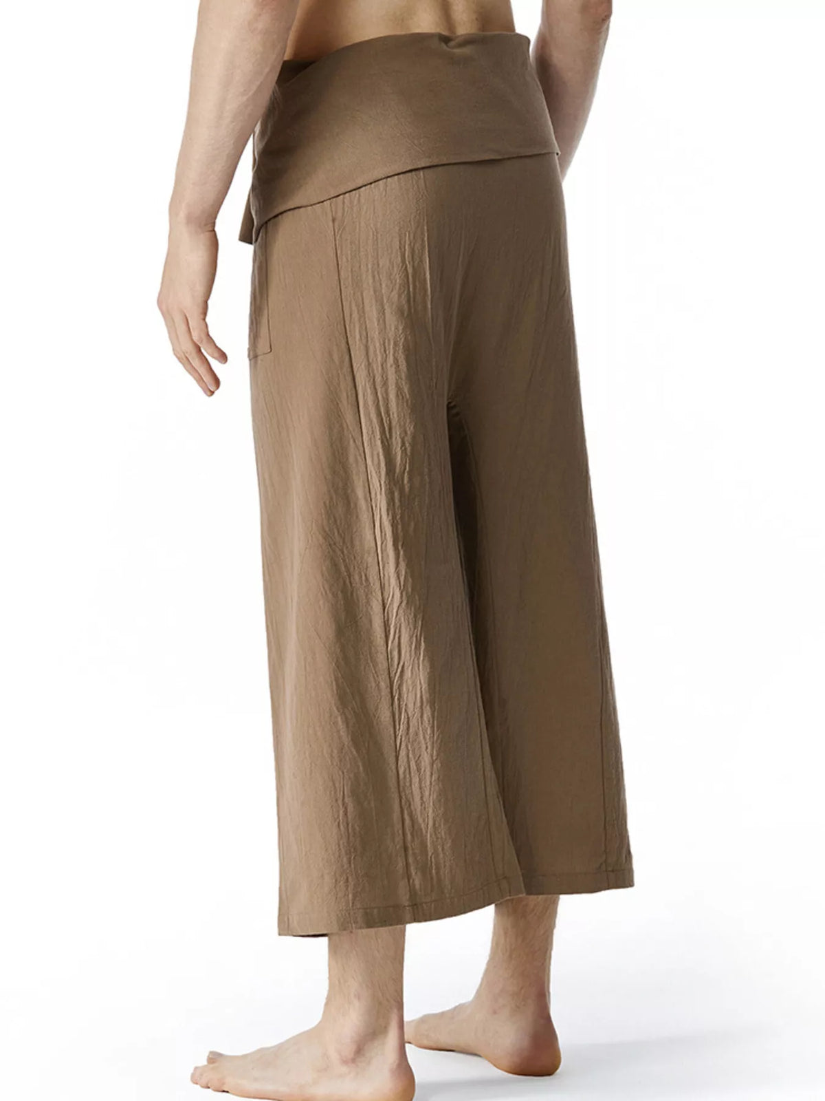 Men's loose-fit drawstring pants in brown, side view with wide leg and elastic waistband.
