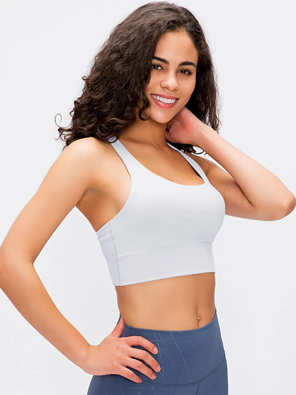 White scoop-neck active tank top with seam detailing and supportive fit