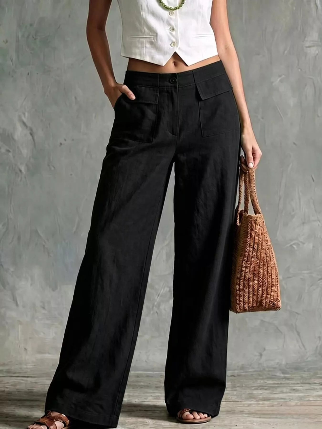 Black wide-leg pants with front pockets and elastic waistband
