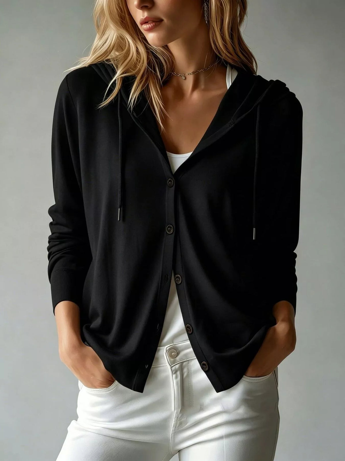 Black hooded button cardigan with drawstring, front pockets, and long sleeves