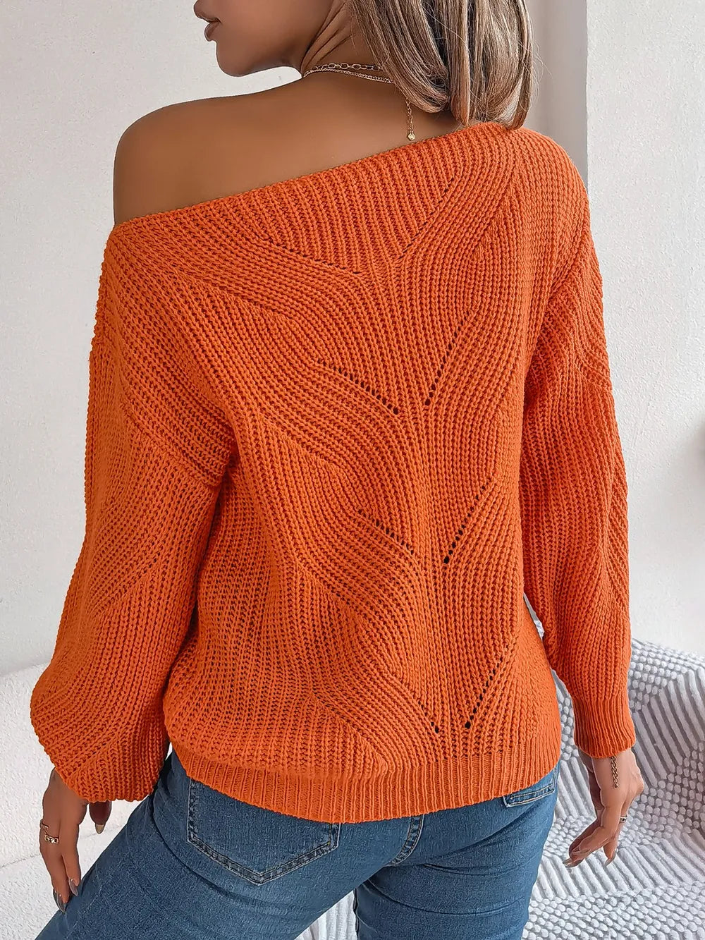 Openwork long-sleeve sweater in rust orange, open-knit back with diagonal pattern