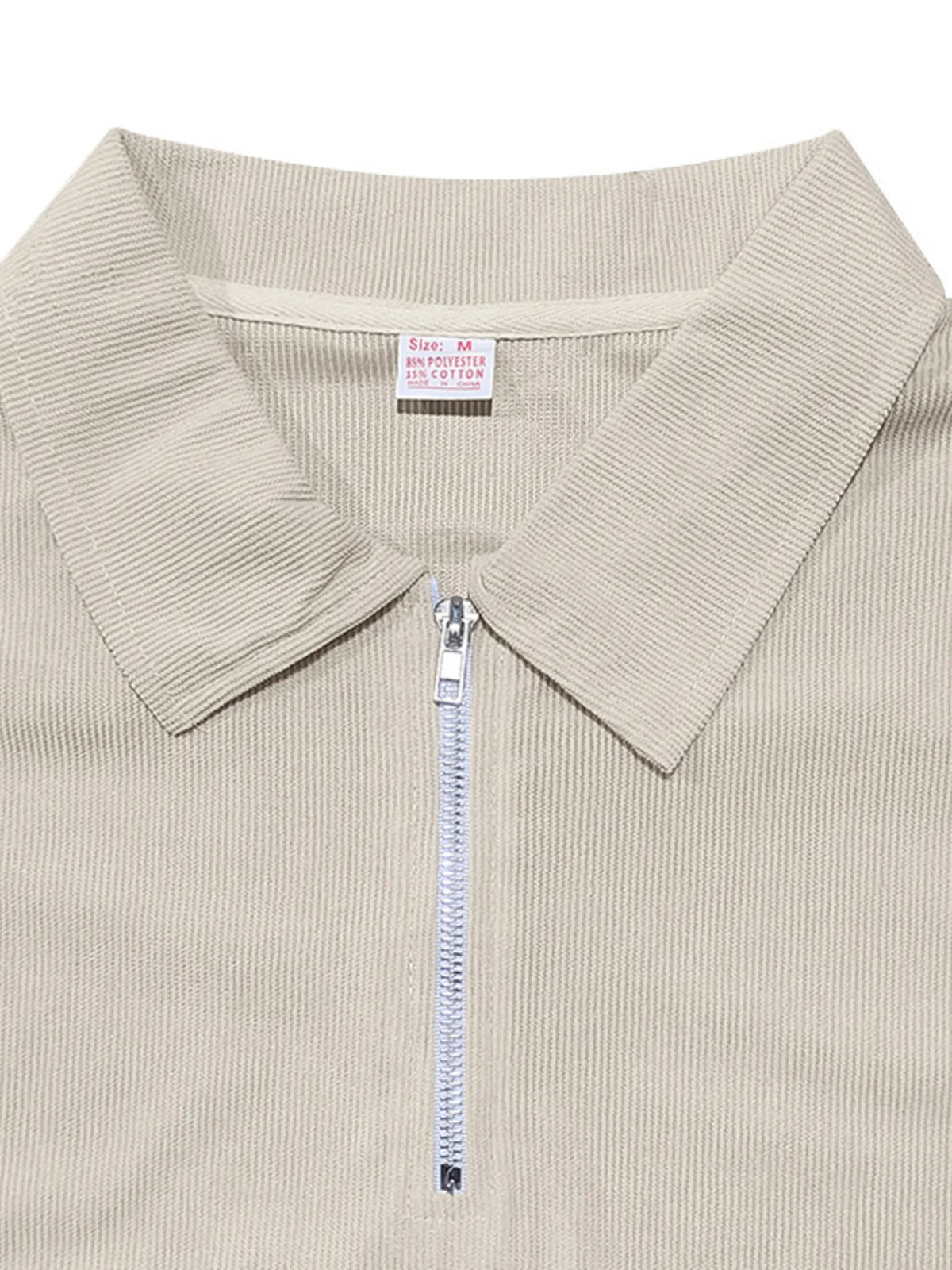 Light beige quarter-zip polo with ribbed collar and zip detail