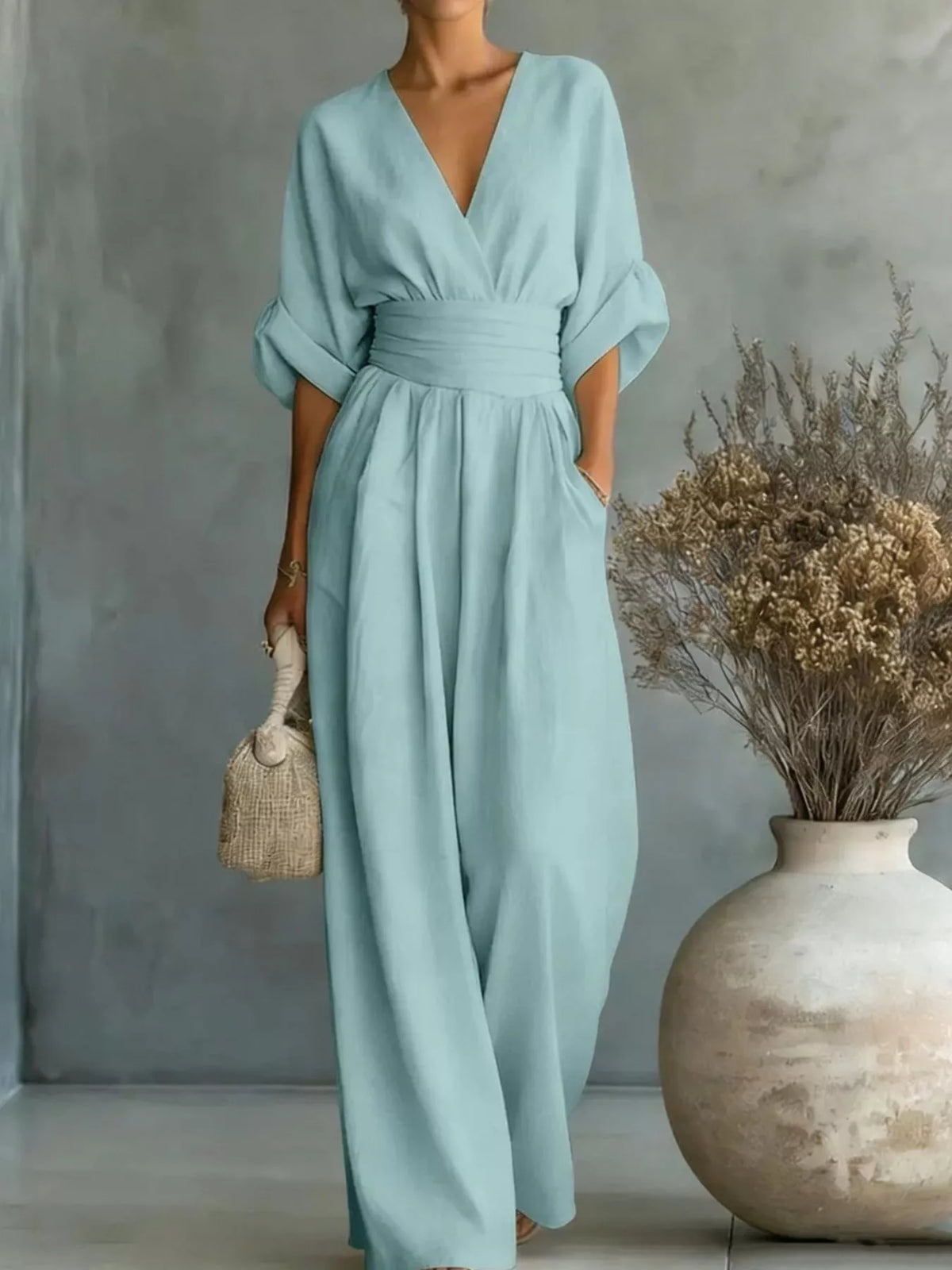 Light blue ruched-waist wide-leg jumpsuit with V-neck and half sleeves