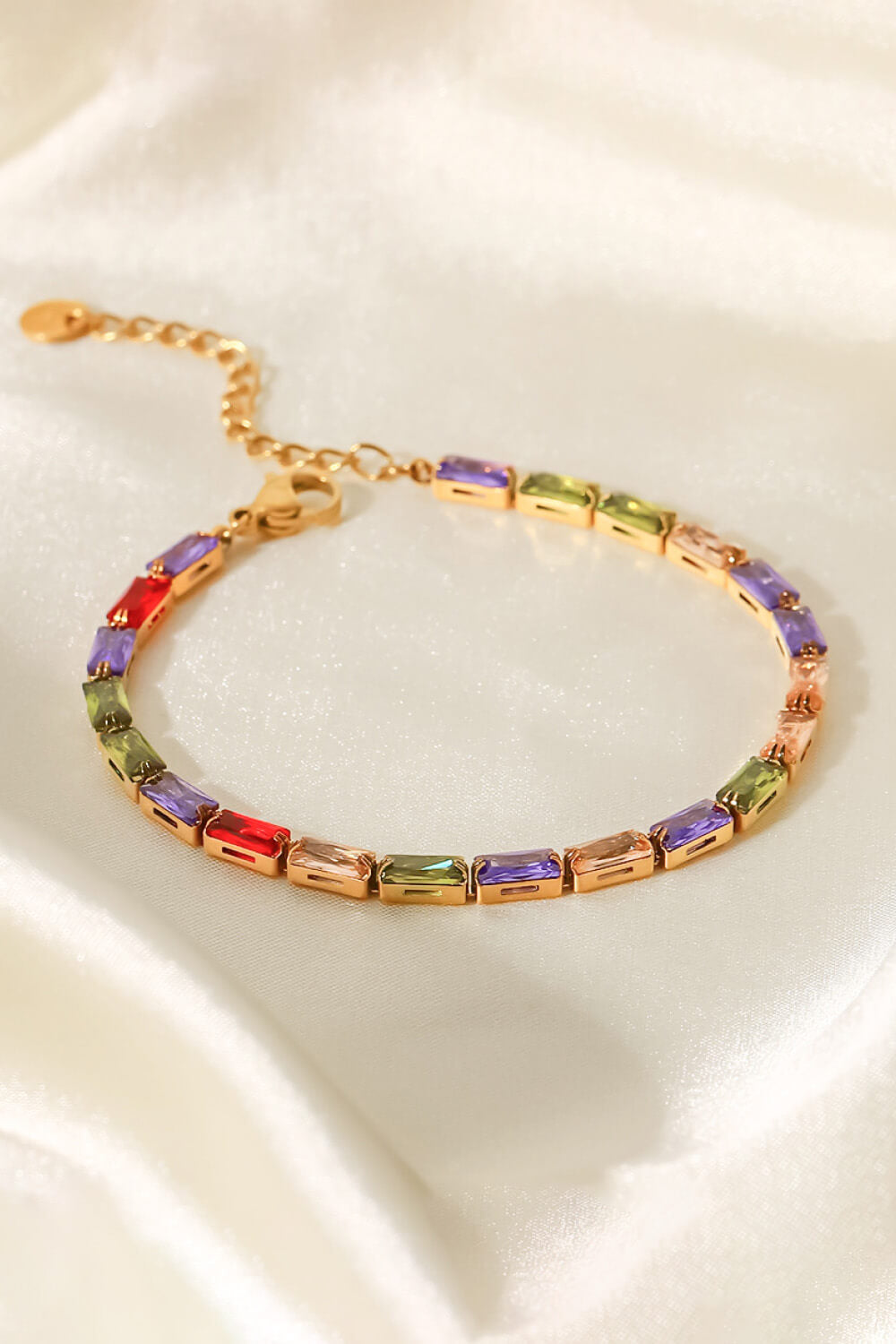 Gold-plated bracelet with multicolored cubic zirconia rectangular stones and hanging chain