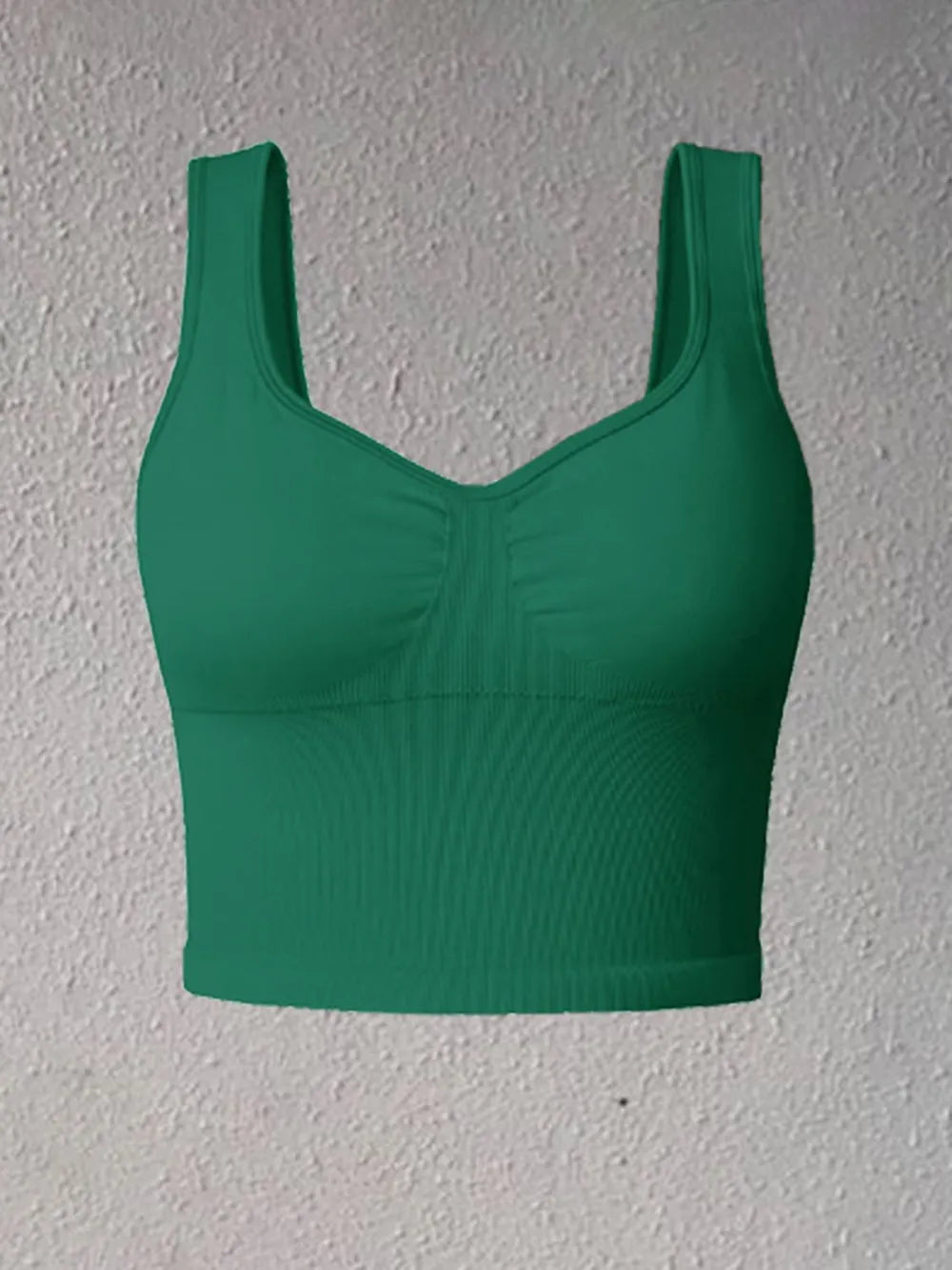 Dark green wide-strap active tank with scoop neck and ruched bust