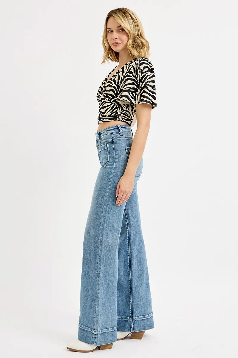 High-rise wide-leg jeans in light blue wash with flared leg and patch pockets