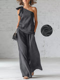 Gray one-shoulder bow top and wide-leg pants set, flowy drape
