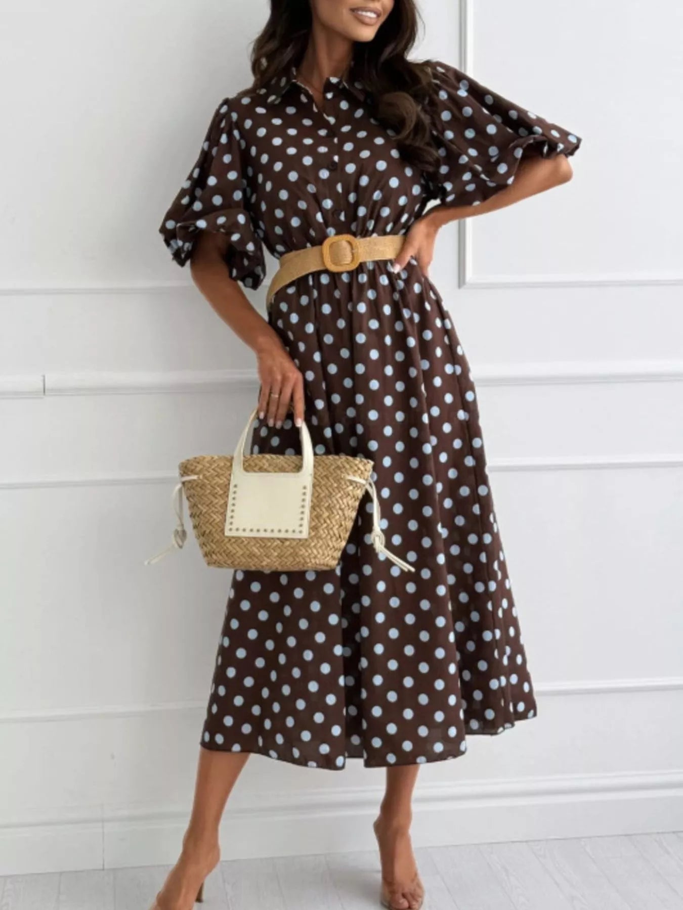 Dark brown polka-dot puff-sleeve midi dress, button front, tan waist belt.