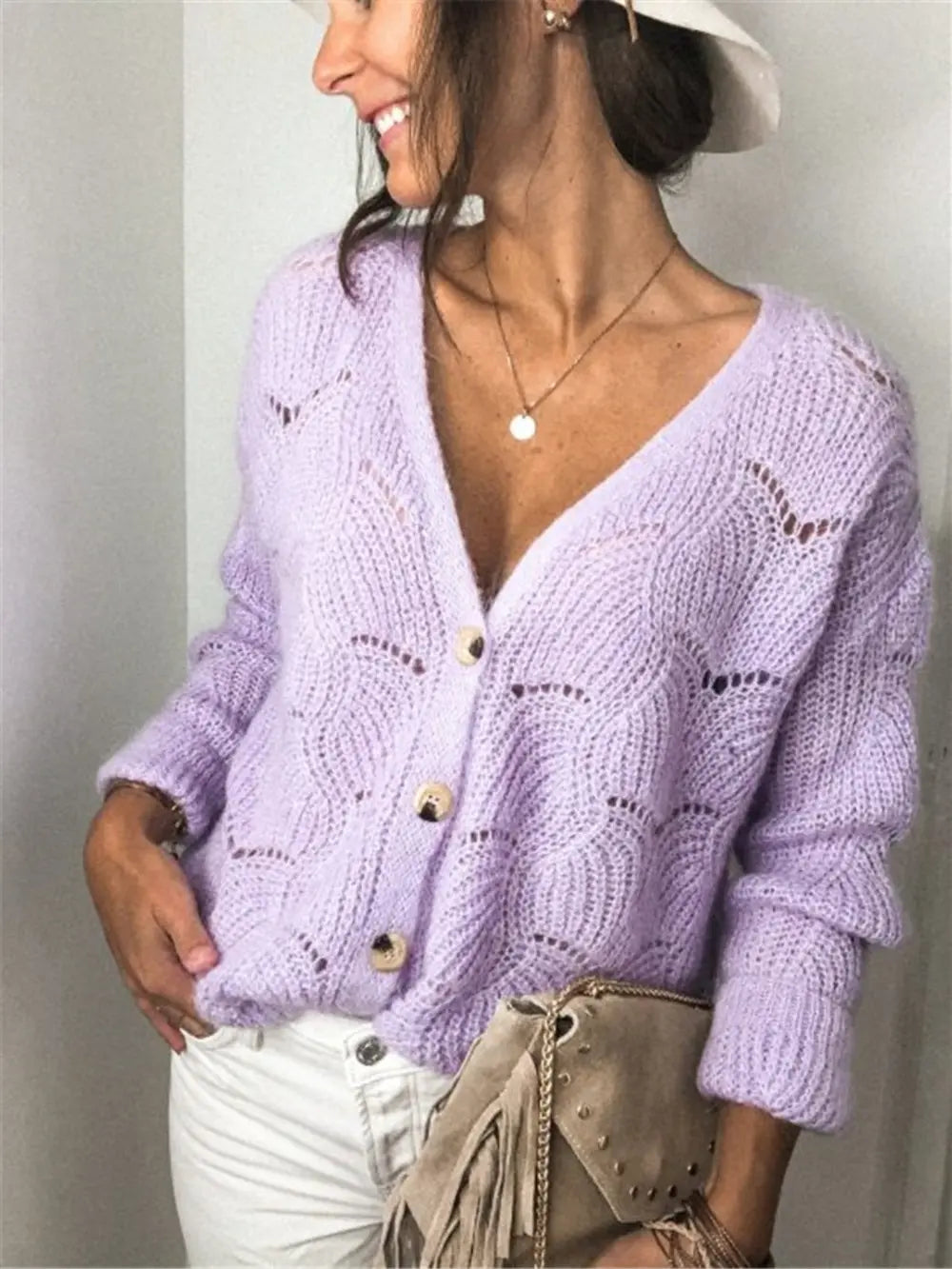 Lavender openwork button-up cardigan with V-neck, long sleeves, and gold button accents.