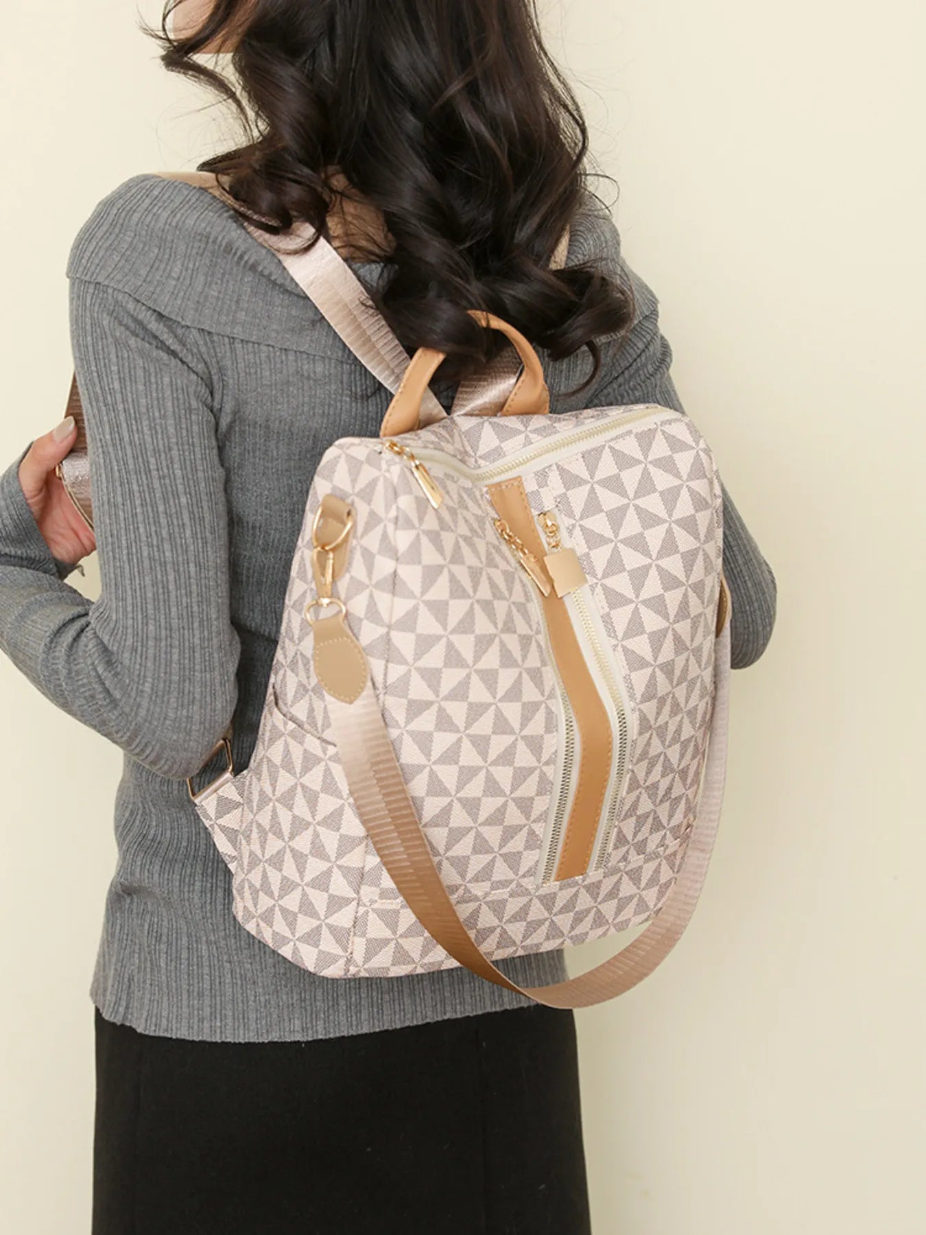 Geometric pattern backpack bag in light beige/cream, tan shoulder straps and top handle