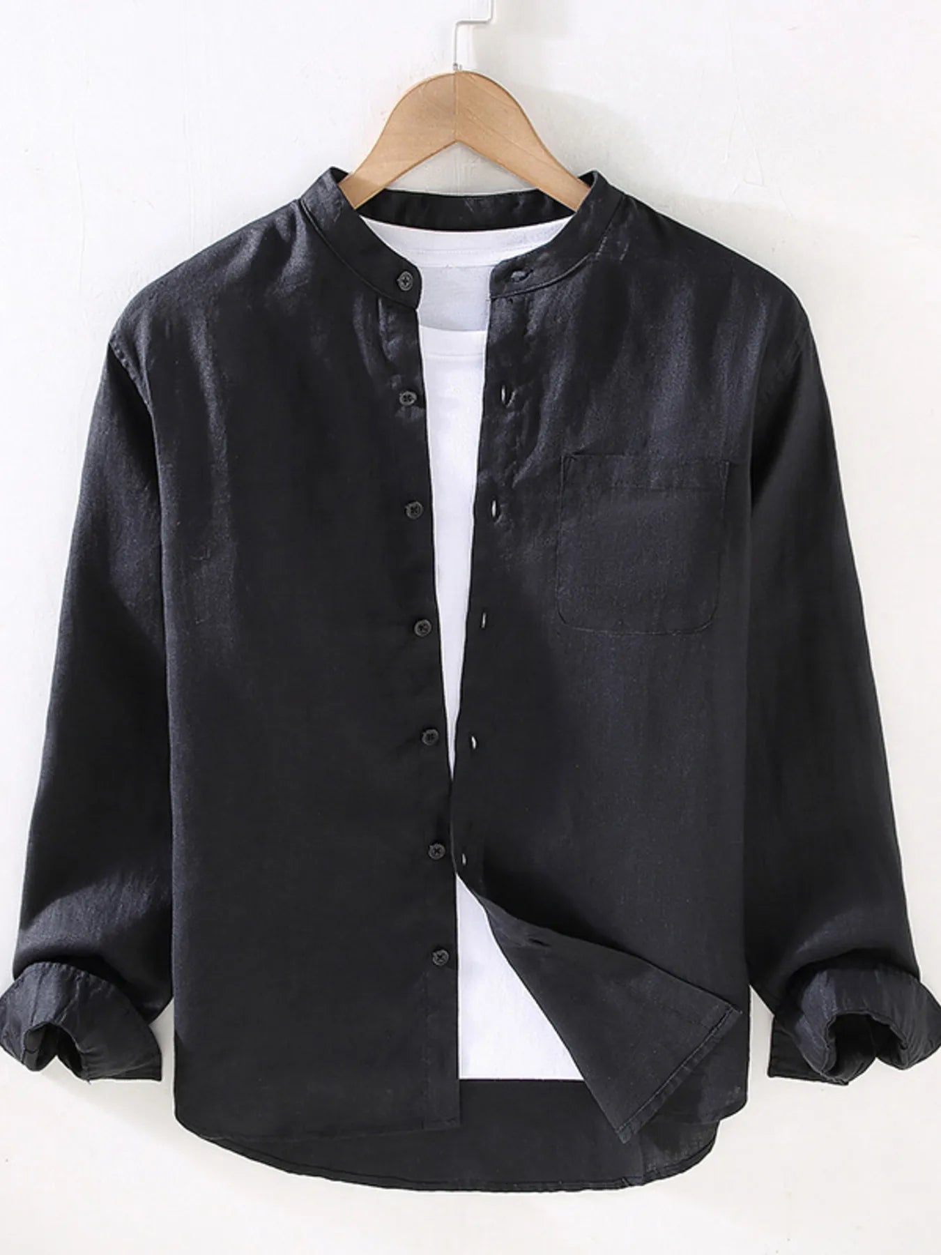 Men's long sleeve button-up shirt in black with front buttons and chest pocket