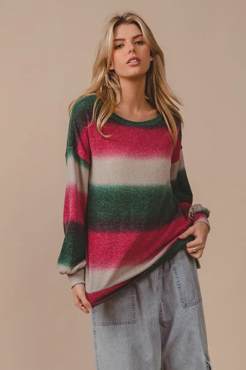 Striped knit top with crew neck; long loose sleeves; fuchsia, cream, and dark green stripes