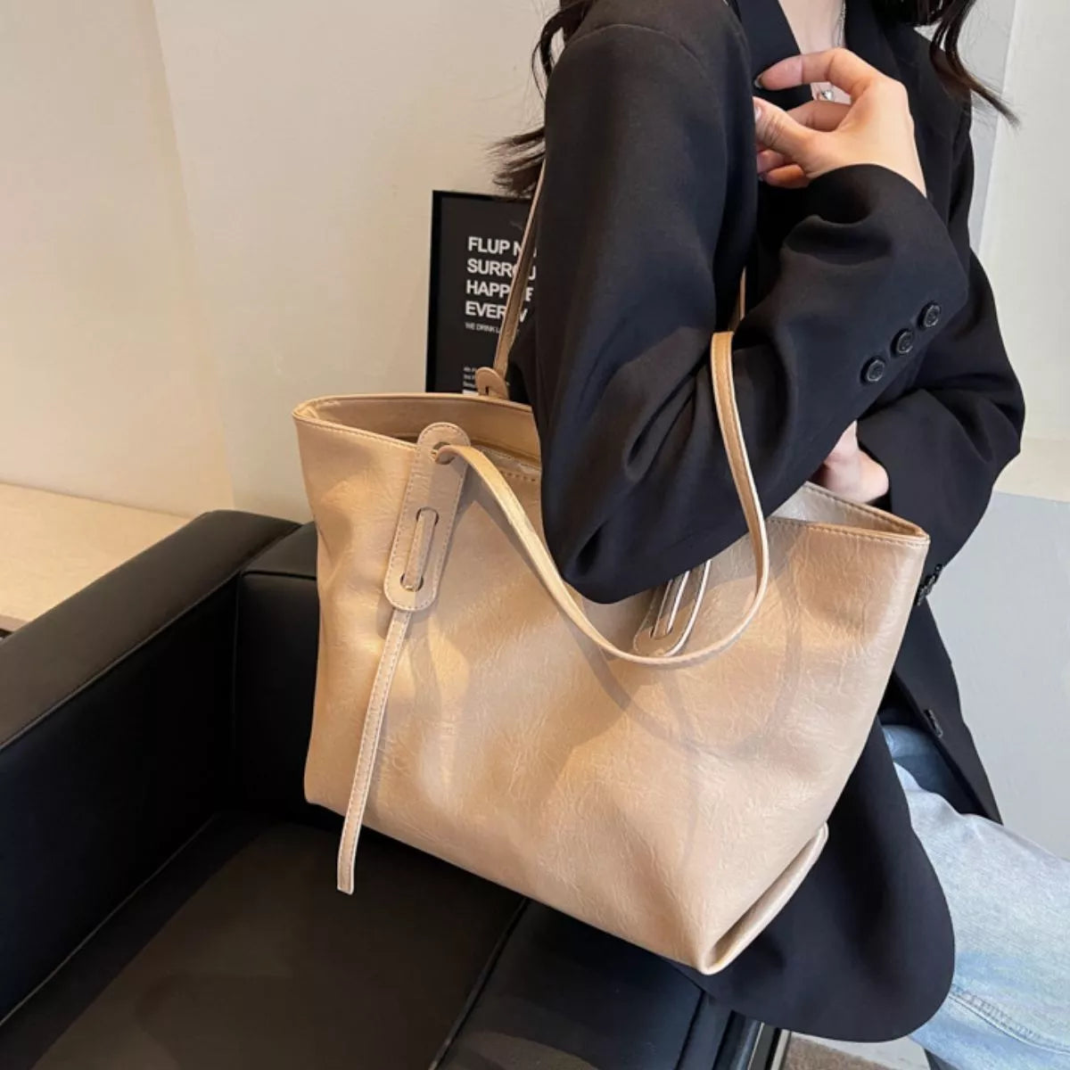 Khaki vegan leather tote bag with adjustable shoulder strap and curved top handles