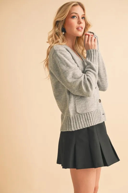 Gray V-neck button cardigan with ribbed hem and buttoned front
