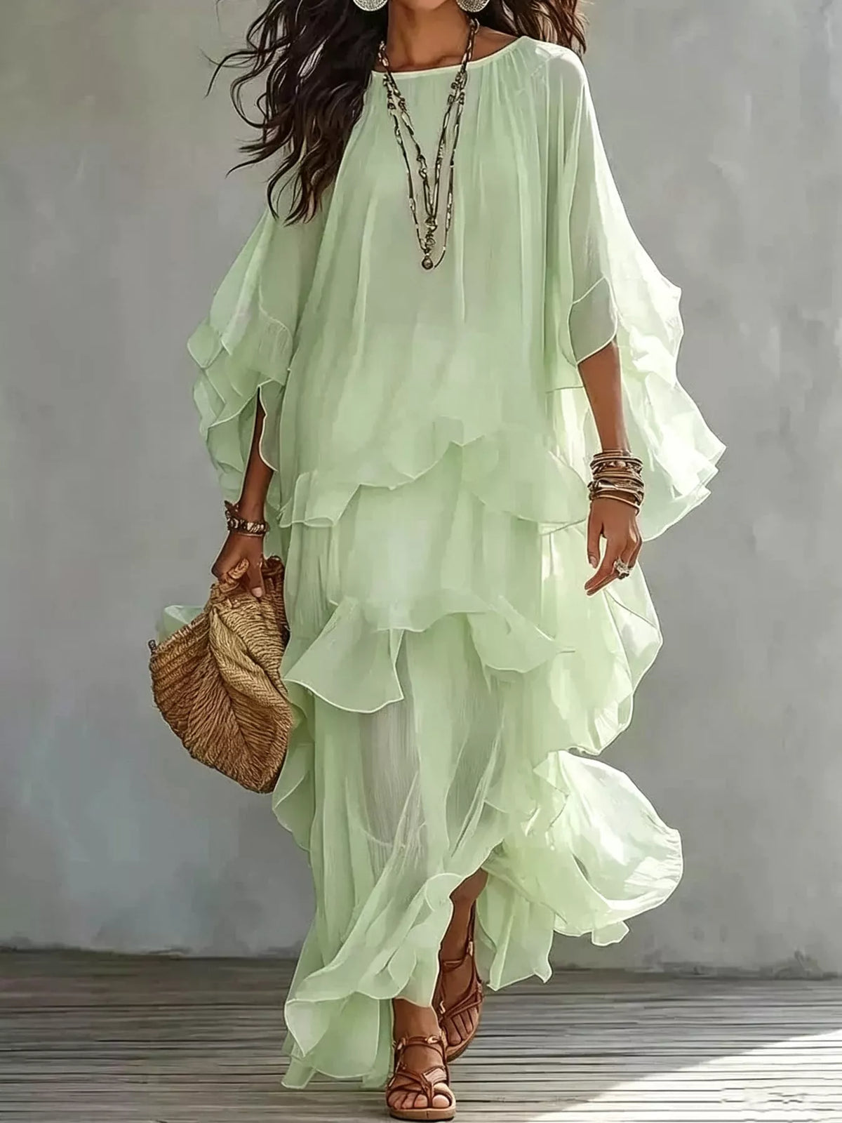 Light green layered maxi dress with cascading ruffles and sheer flutter sleeves
