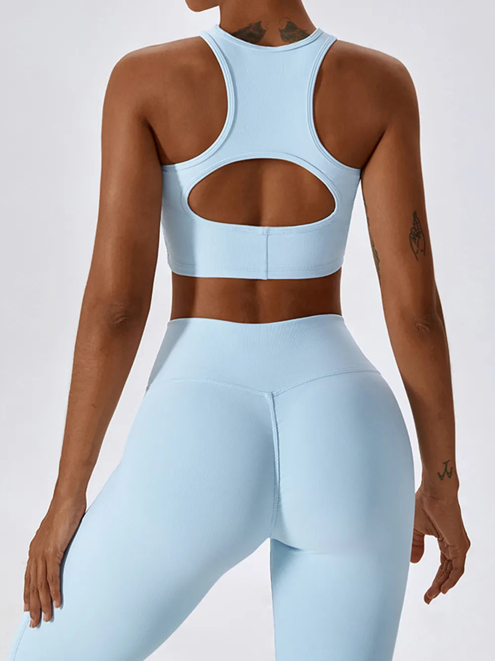 Light blue racerback active crop tank with oval cutout back