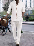 Men's white button-front long-sleeve shirt and pants set with gold buttons