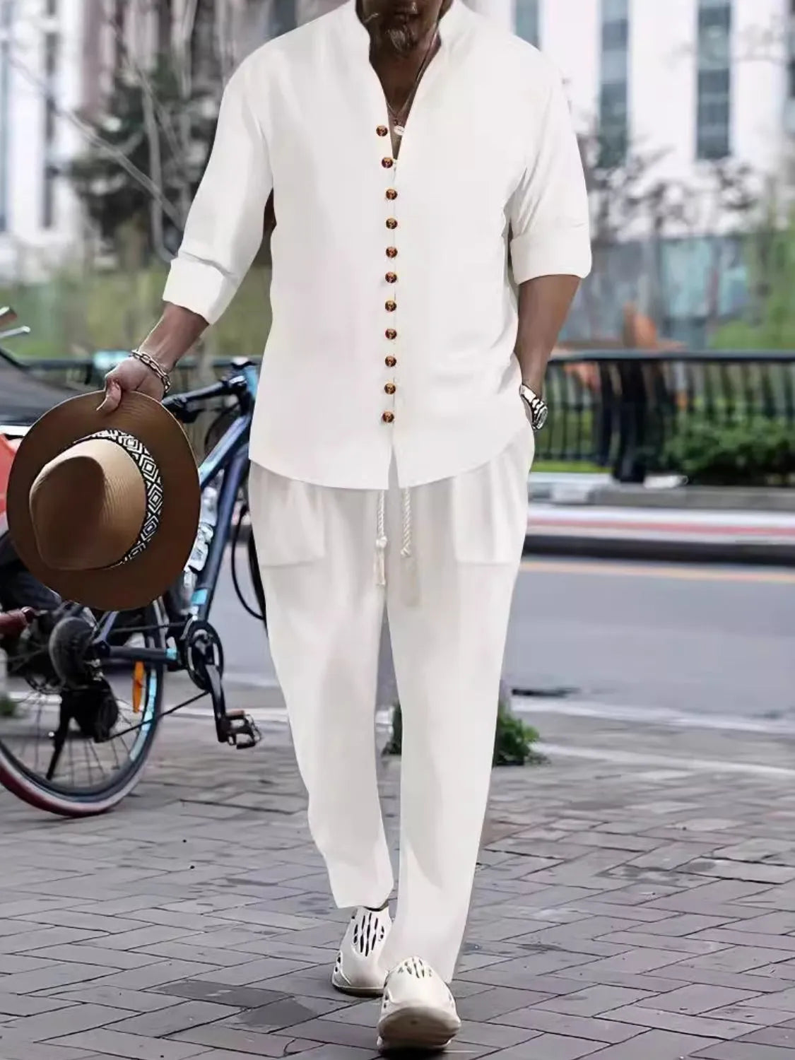 Men's white button-front long-sleeve shirt and pants set with gold buttons
