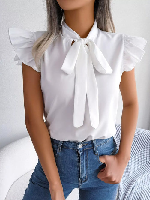 White bow-tie ruffle-sleeve blouse with front ribbon bow and short puff sleeves