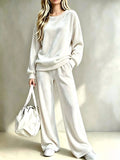 White velvet two-piece set with dropped-shoulder sweatshirt and wide-leg pants