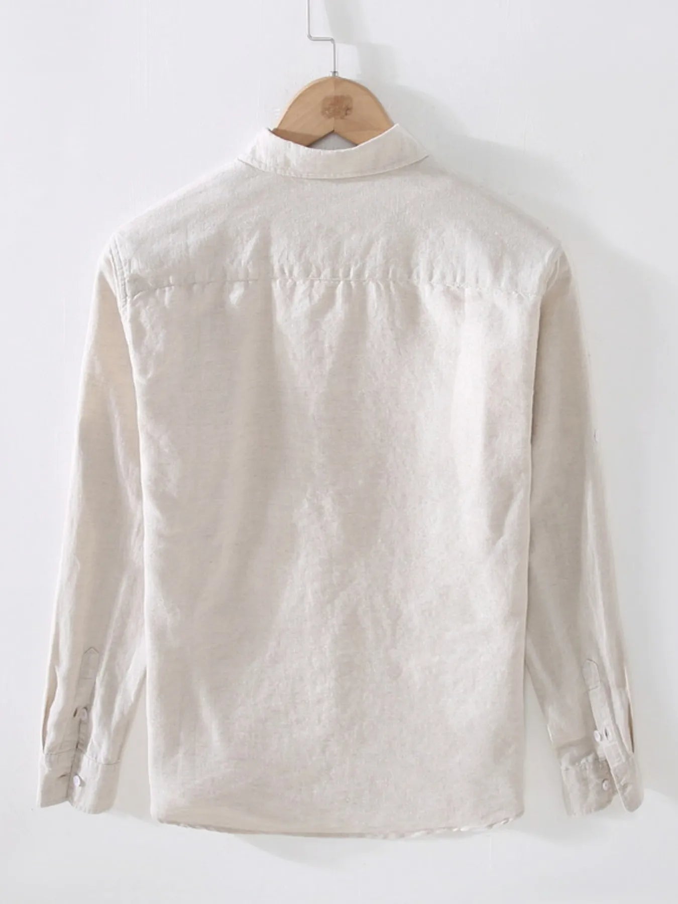 Cream short-sleeve button-up shirt, back view with point collar