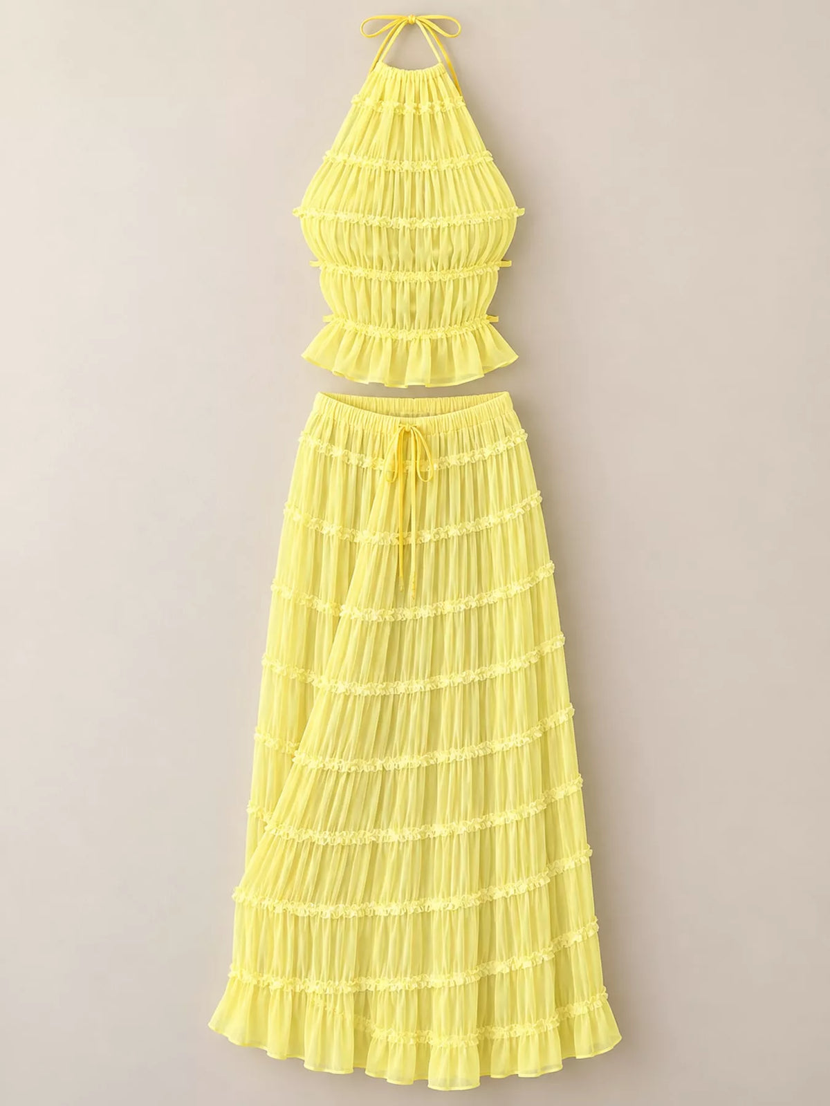 Yellow ruffled halter crop top and tiered maxi skirt set, back view
