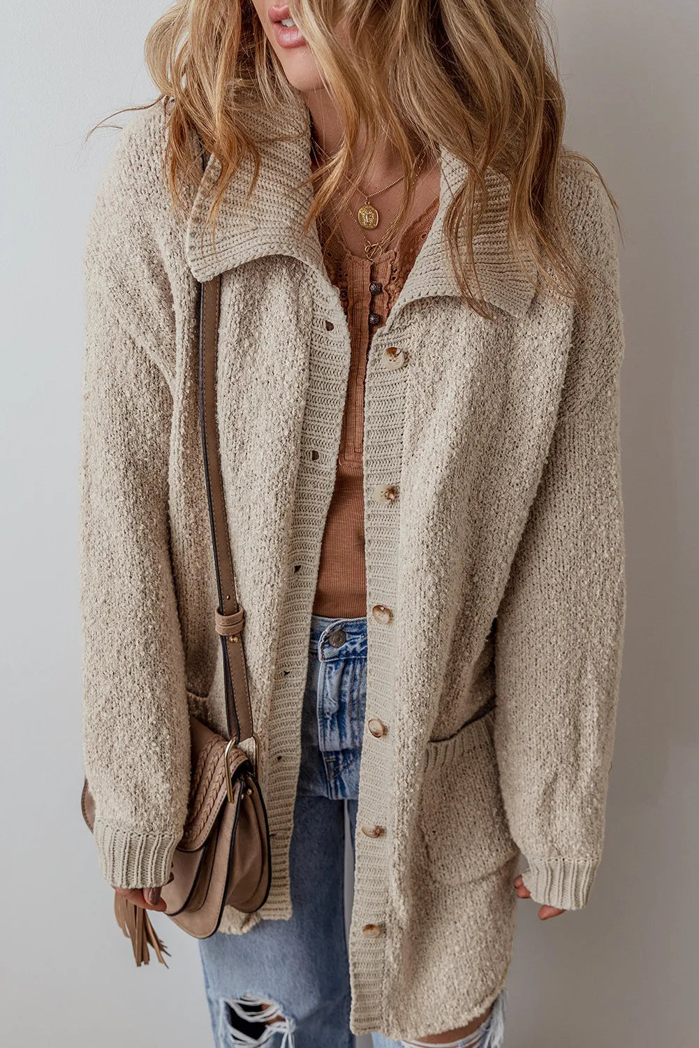Dust Storm textured knit cardigan with button front, patch pockets, and ribbed hem
