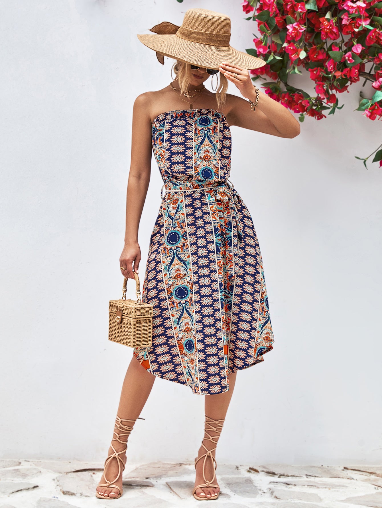 Printed strapless tie belt dress in blue with multicolor medallion pattern, belt tie at waist