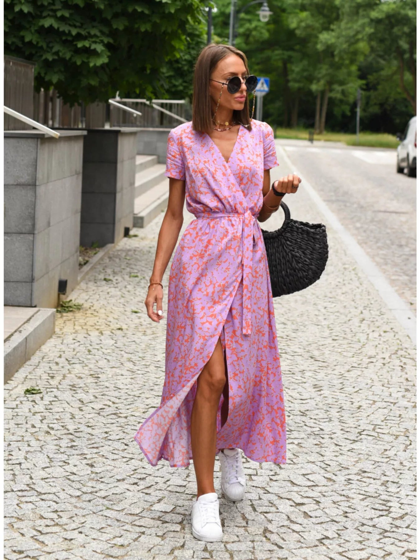 Pink floral midi wrap dress with short sleeves, surplice V-neck, and front side slit