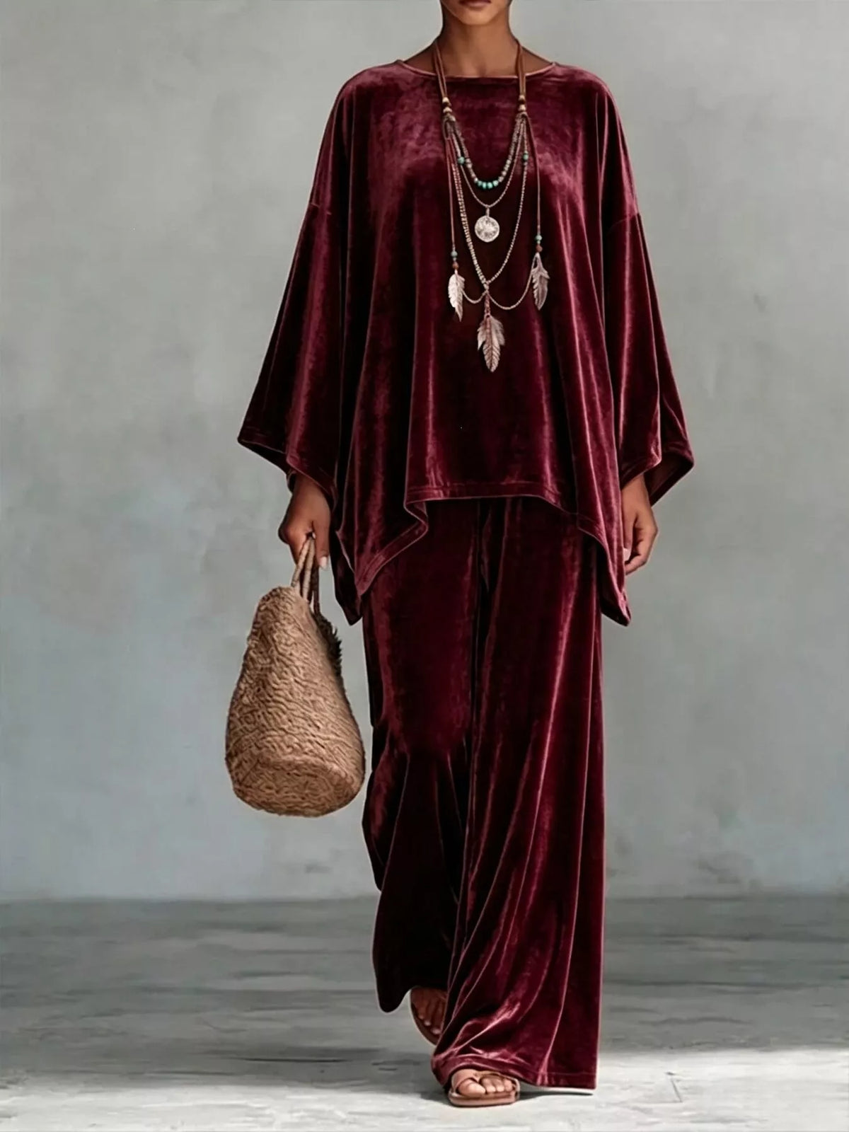 Burgundy velvet wide-leg pants set with loose asymmetrical poncho-style top