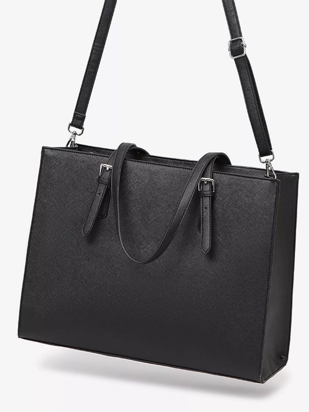 Black large tote bag with two top handles and dual front straps; structured rectangular shape.