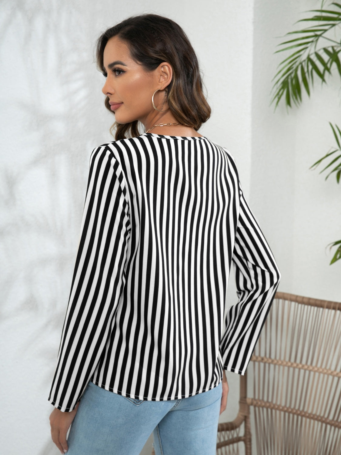 Black-and-white striped long-sleeve blouse, back view with V-shaped neckline