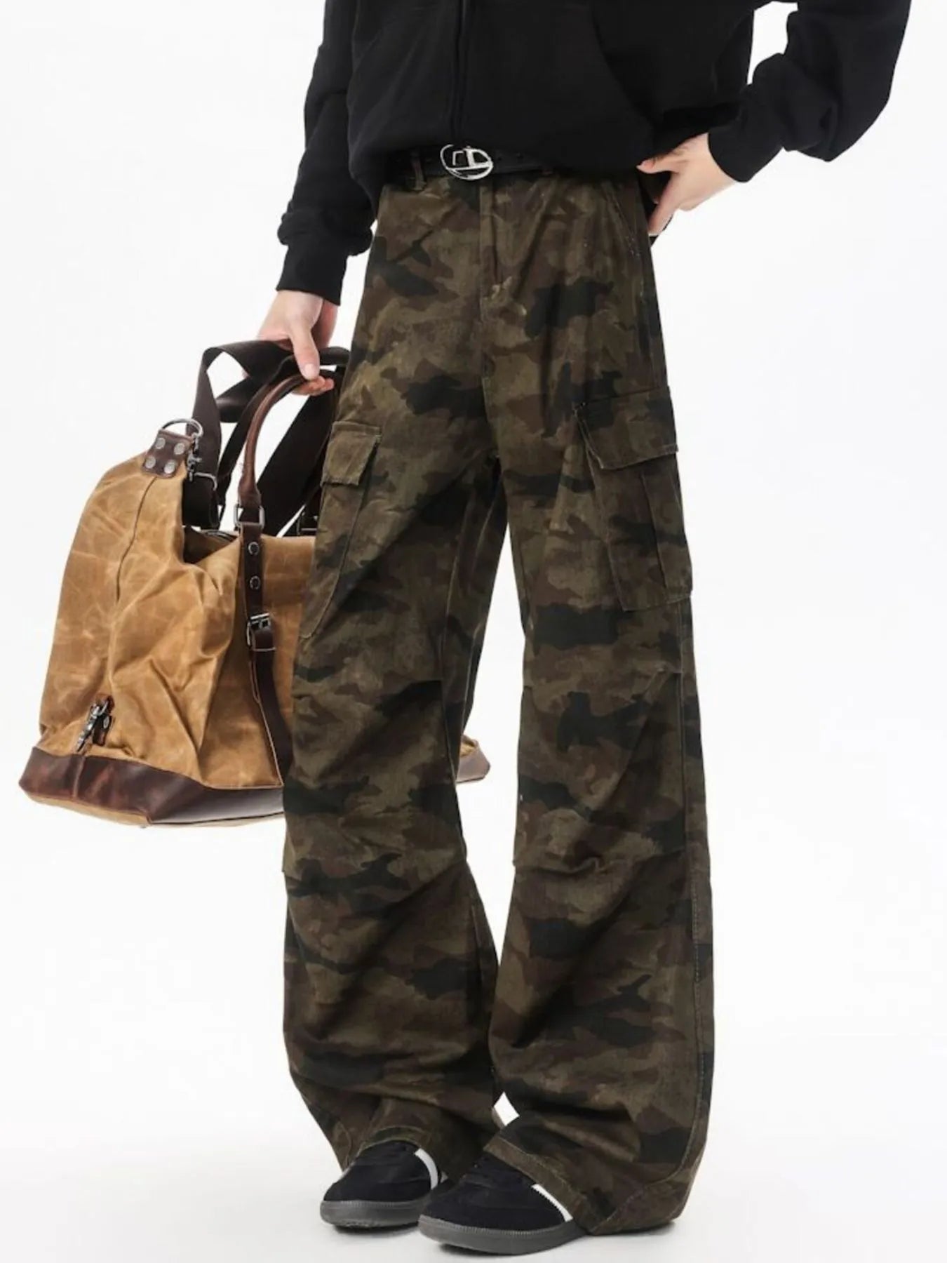 Camouflage wide-leg cargo pants with black belt, front flap pockets, and ankle-length hems