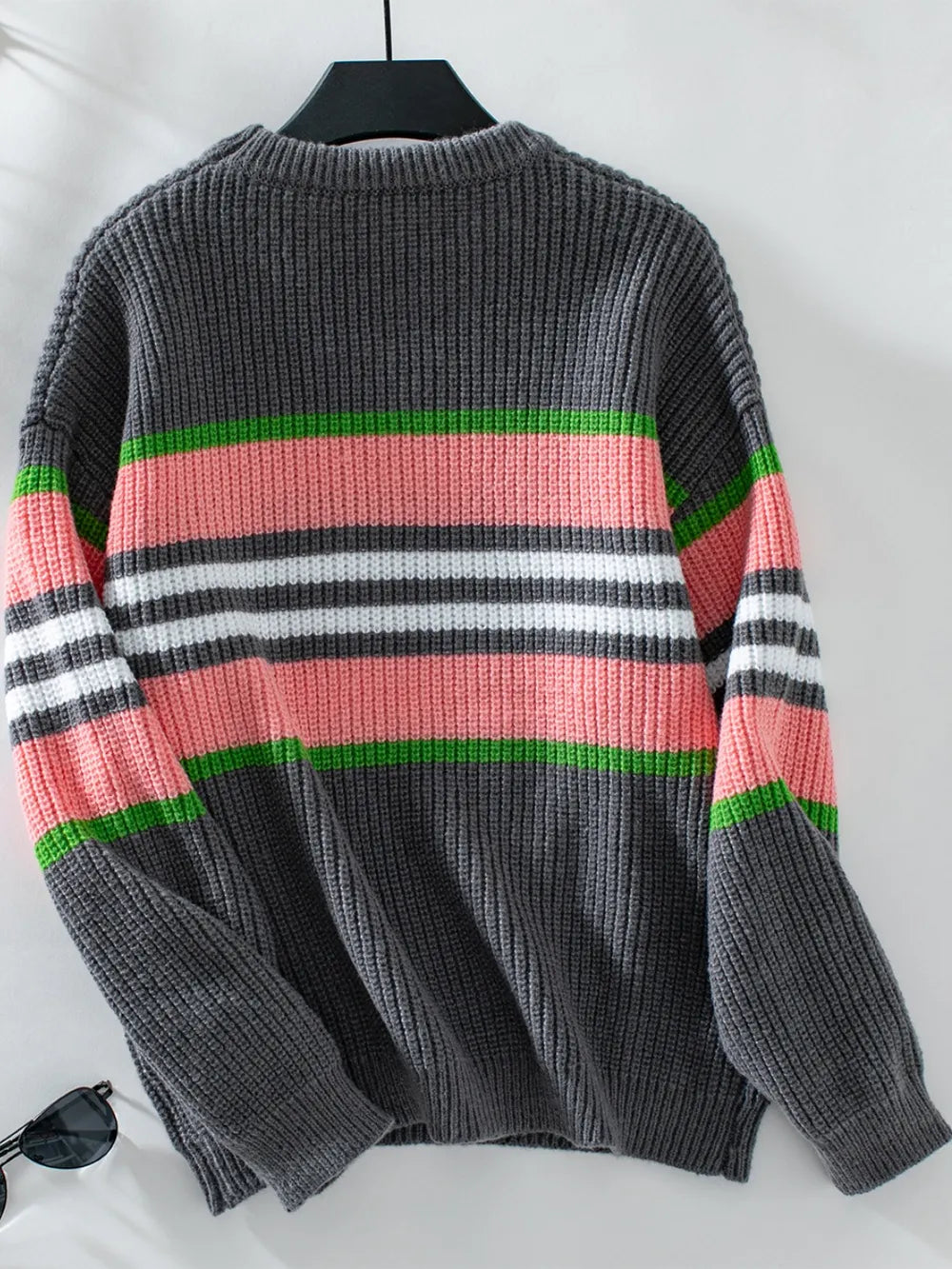 Dark gray round-neck striped sweater back view on a hanger, long sleeves