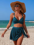 V-Neck High-Waisted Teal Swim Set with matching wrap skirt at the beach