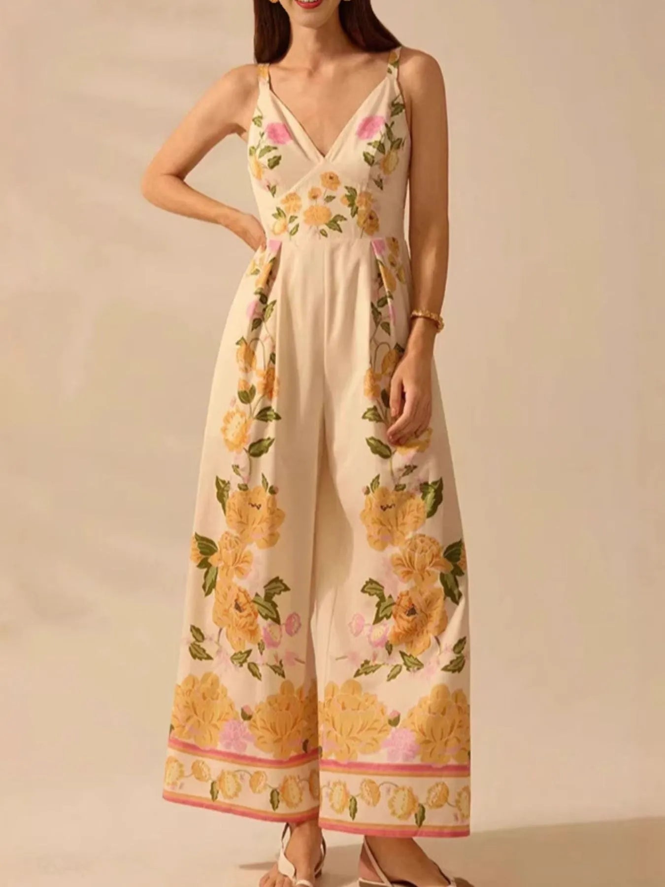 Cream floral wide-leg v-neck cami jumpsuit with spaghetti straps and gathered waist