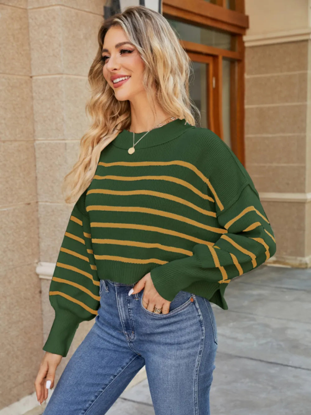 Green striped lantern sleeve sweater with round neckline and tan horizontal stripes