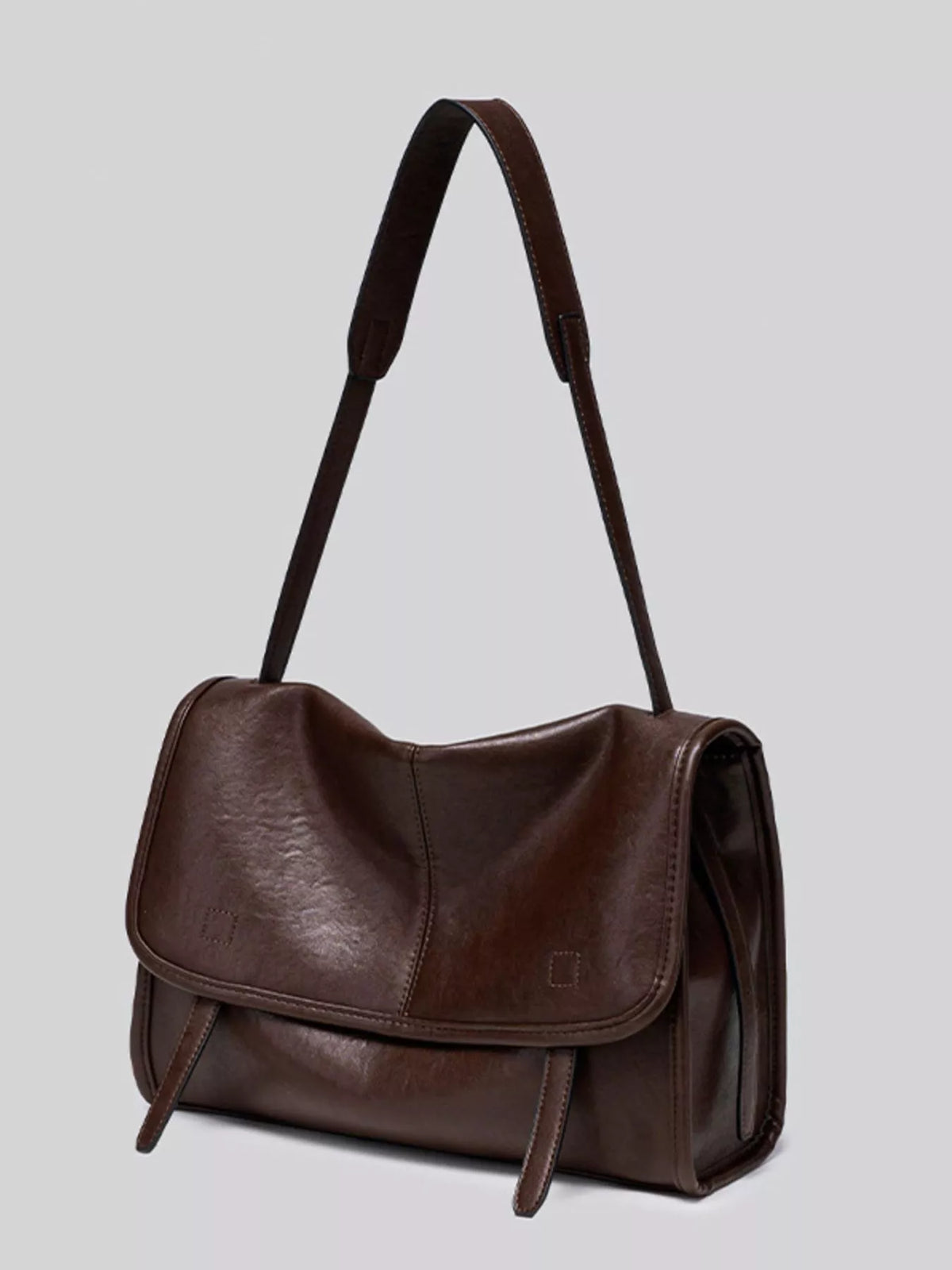 Brown vegan leather messenger shoulder bag with flap, buckle closure, and side pocket