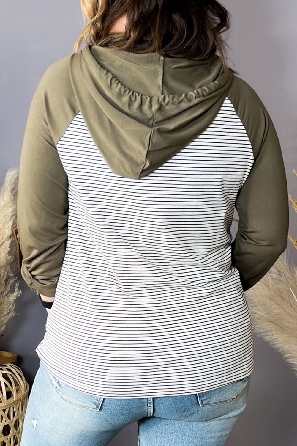Plus-size striped long-sleeve hoodie back view, moss hood, striped body, kangaroo pocket.