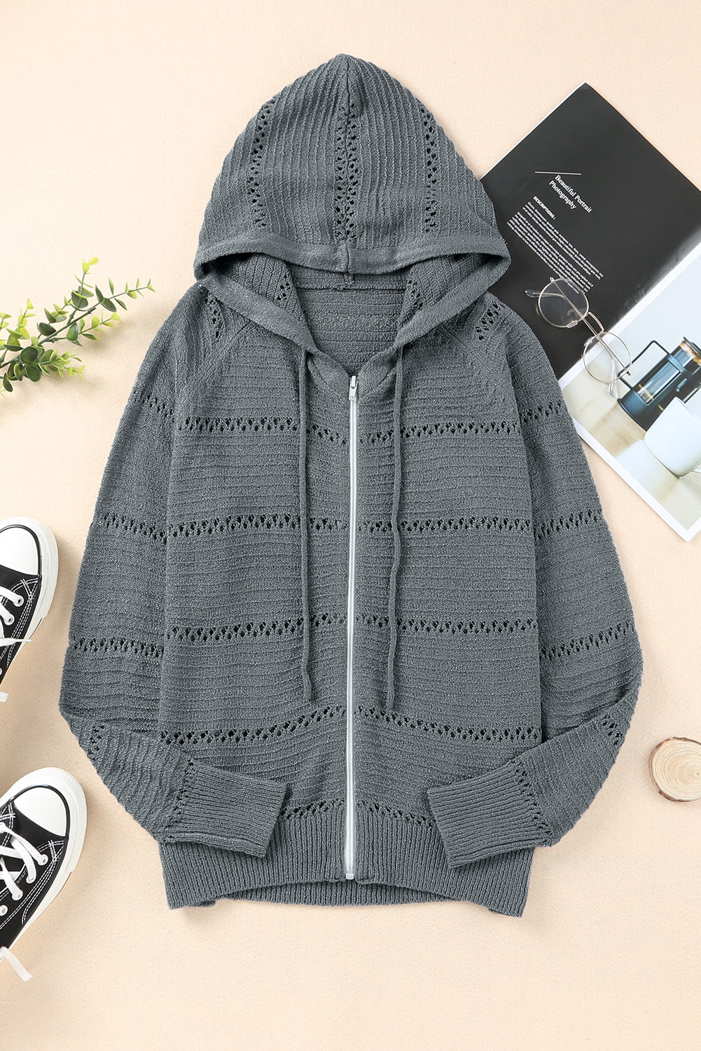 Gray openwork knit zip-up hooded cardigan with ribbed cuffs and hood